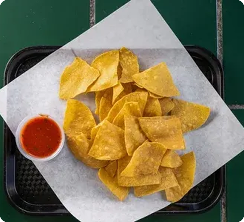 Tortilla chips with salsa on a tray.