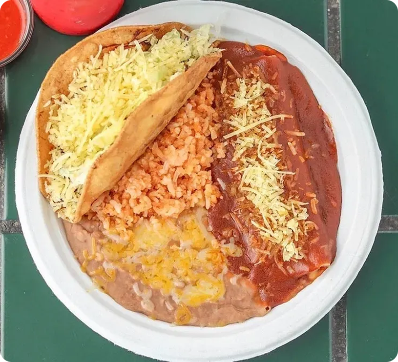 Mexican plate with taco, rice, enchilada, beans.